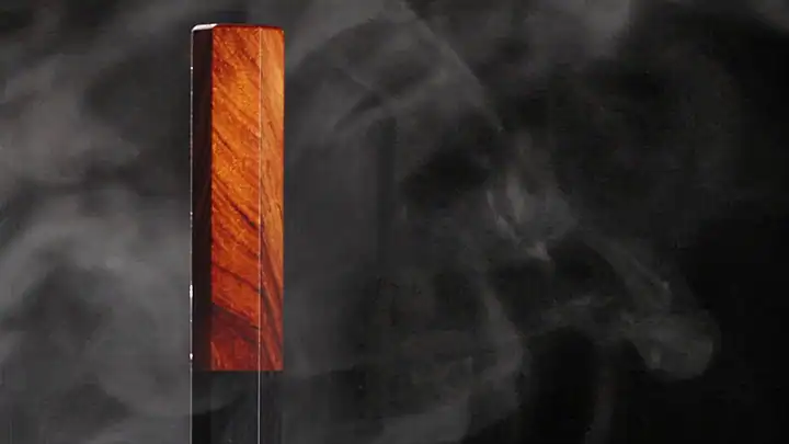 The octagonal sandalwood handle of an Oni Craft knife